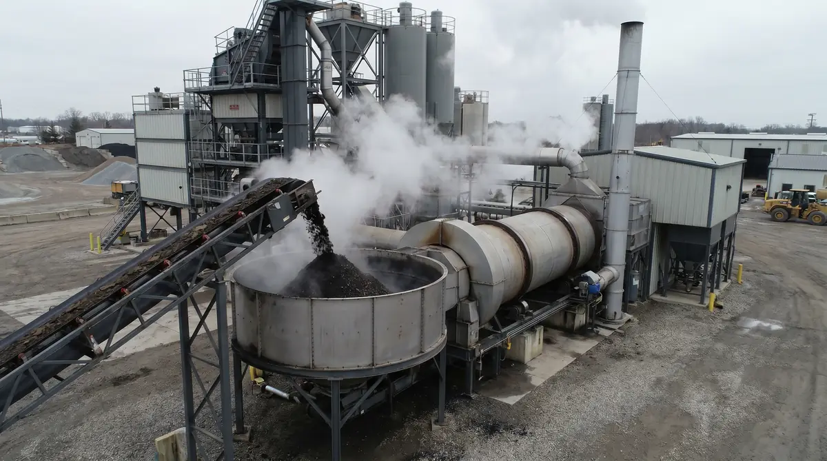RAP reclaimed asphalt being fed into an asphalt drum mixing plant